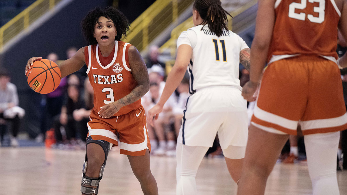 University of Texas Rori Harmon (3) calls a play with West Virginia University JJ Quinerly (11) defending during the second quarter of the Women's Gulf Coast Showcase.