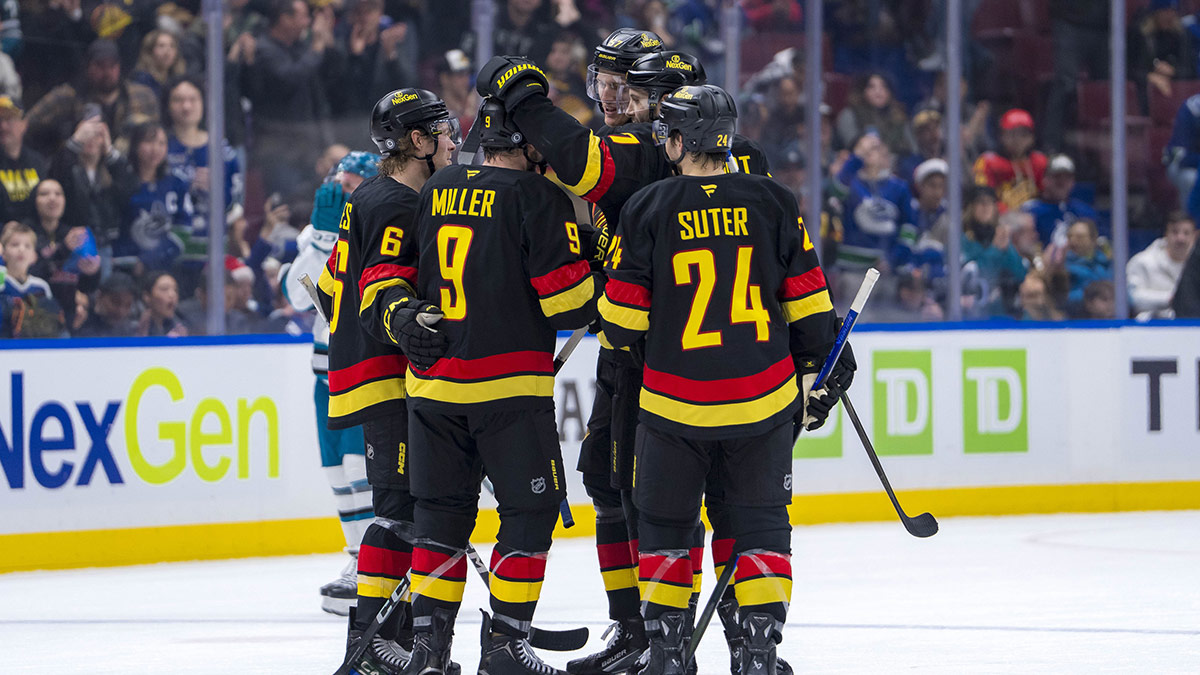 Vancouver Canucks forward J.T. Miller (9) and forward Brock Boeser (6) and forward Pius Suter (24) and defenseman Tyler Myers (57) and defenseman Carson Soucy (7) celebrate thier victory against the San Jose Sharks at Rogers Arena.