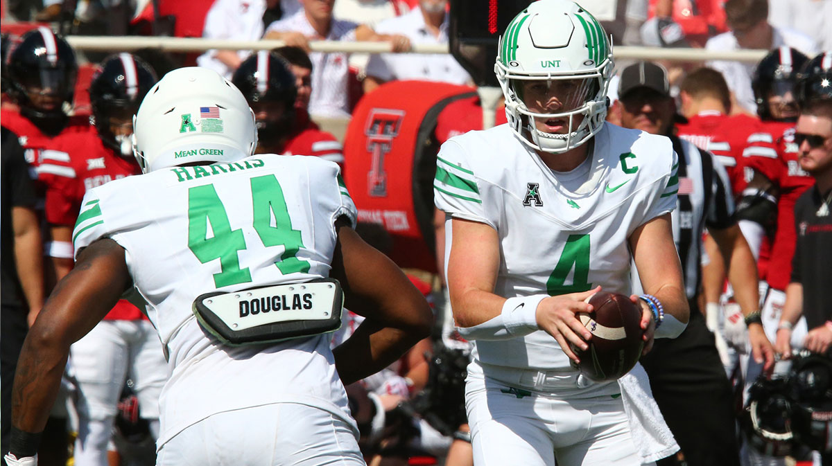 North Texas Mean Green quarterback Chandler Morris (4) prepares to give the ball to running back Damashja Harris (44) in the first half at Jones AT&T Stadium and Cody Campbell Field.
