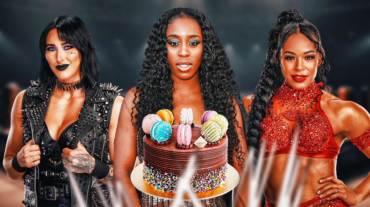 WWE stars Rhea Ripley, Naomi, and Bianca Belair with birthday cake.
