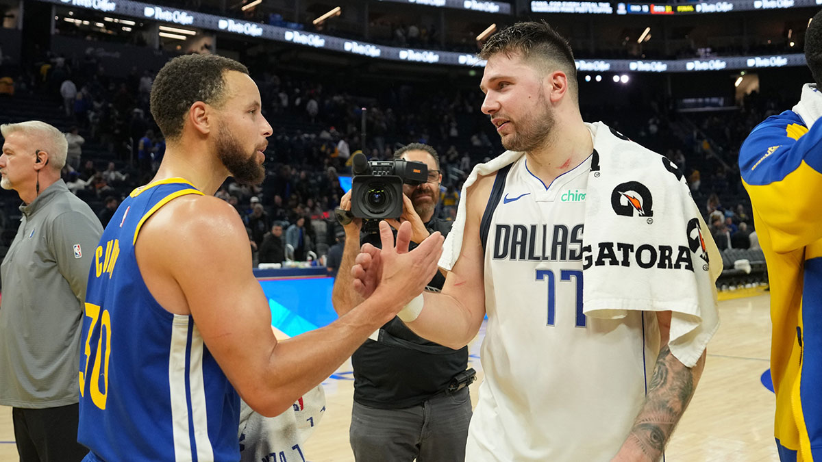Golden State Warriors guard Stephen Curry (30) and Dallas Mavericks guard Luka Doncic (77) greet each other after the game at Chase Center. Mandatory Credit: Darren Yamashita-Imagn Images