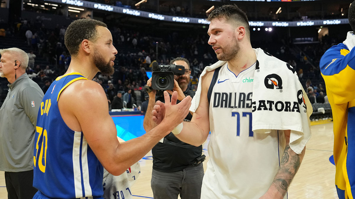 Warriors guard Stephen Curry (30) and Dallas Mavericks guard Luka Doncic (77) greet each other