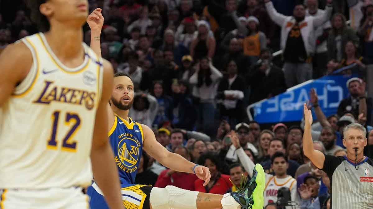 Warriors guard Stephen Curry (30) watches his three-point attempt