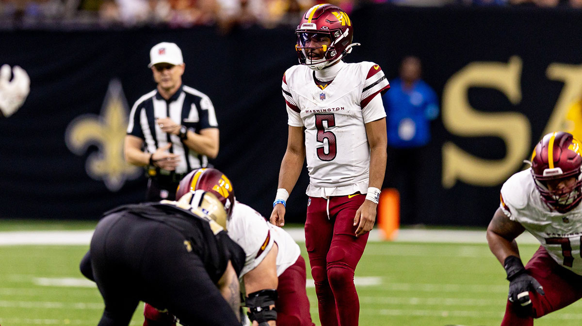 Washington Commanders quarterback Jayden Daniels (5) against the New Orleans Saints during the second half at Caesars Superdome.