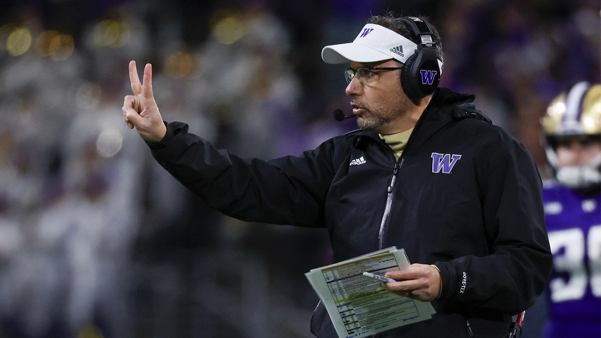 Washington Huskies head coach Jedd Fisch signals for a two-point conversion try against the USC Trojans following a touchdown during the fourth quarter at Alaska Airlines Field at Husky Stadium.