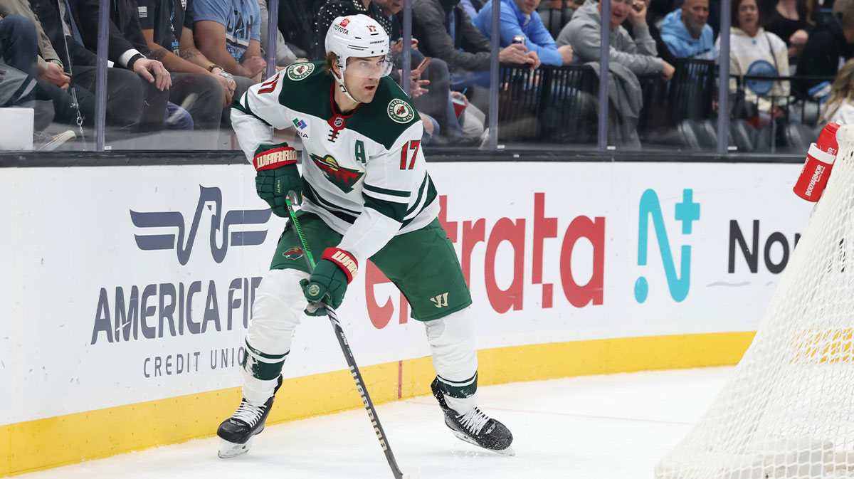 Minnesota Wild left wing Marcus Foligno (17) looks to pass against the Utah Hockey Club during the first period at Delta Center.