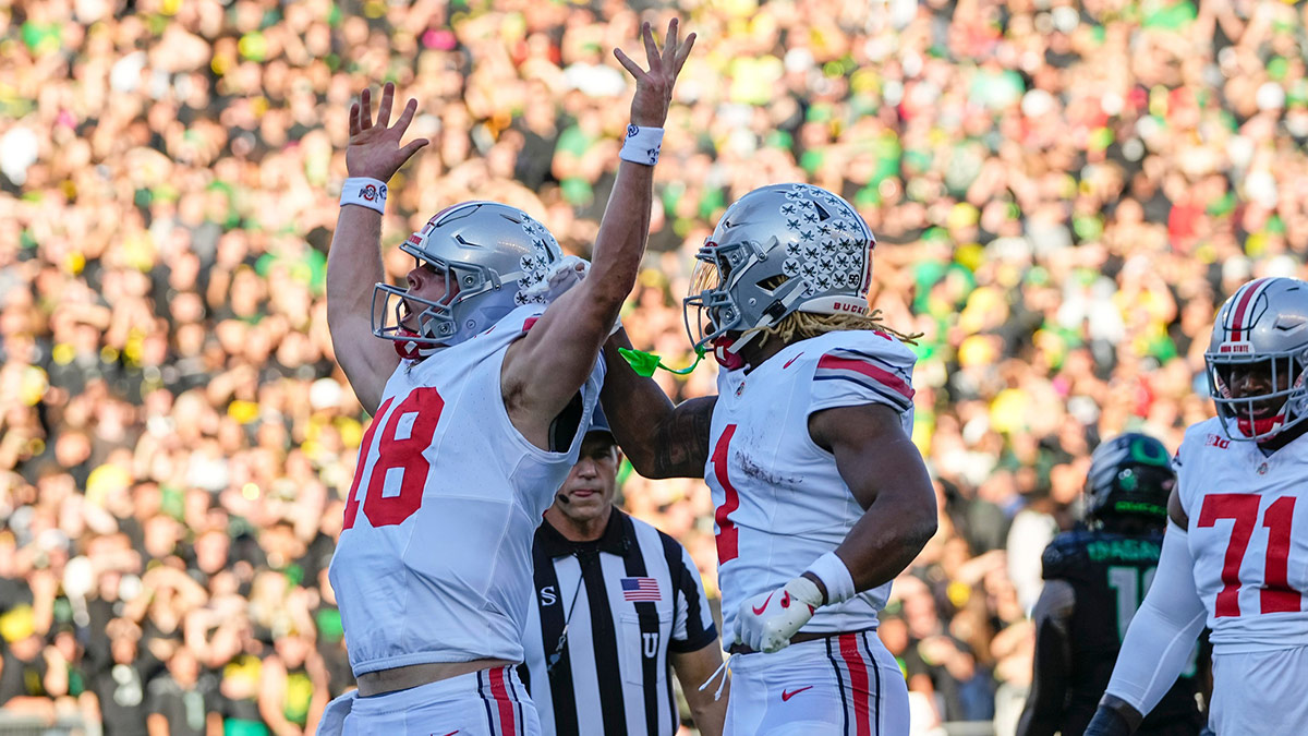 Ohio State Buckeyes quarterback Will Howard (18) celebrates scoring a touchdown during the first half of the NCAA football game against the Oregon Ducks at Autzen Stadium