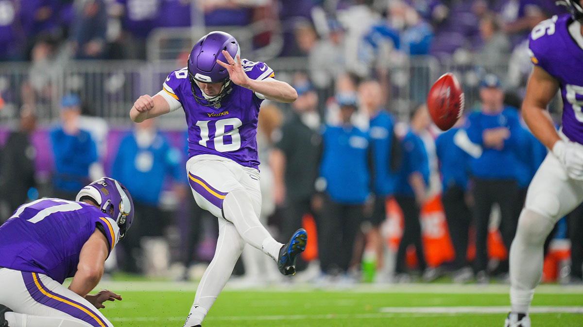 Minnesota Vikings place kicker Will Reichard (16) kicks an extra point against the Indianapolis Colts in the fourth quarter at U.S. Bank Stadium.