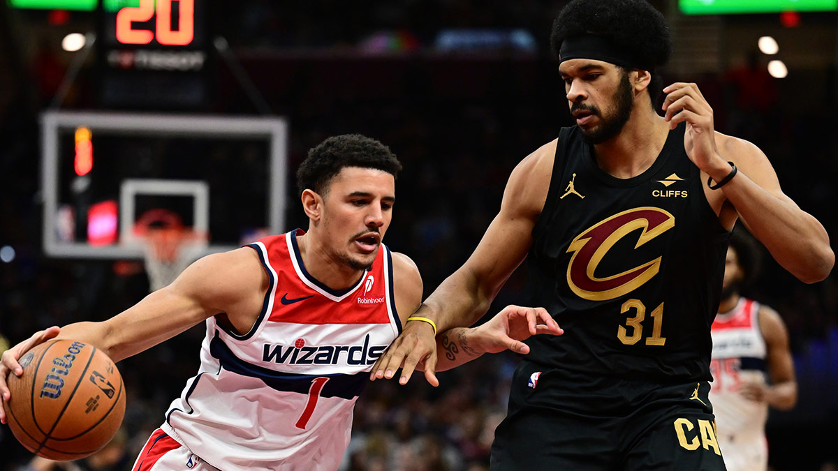 Washington Wizards guard Johnny Davis (1) drives to the basket against Cleveland Cavaliers center Jarrett Allen (31) during the first half at Rocket Mortgage FieldHouse.