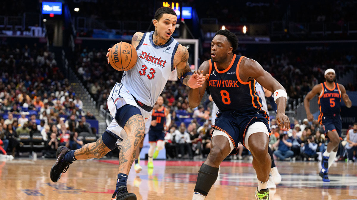 Washington Wizards forward Kyle Kuzma (33) drives to the basket against New York Knicks forward OG Anunoby (8) during the third quarter at Capital One Arena.