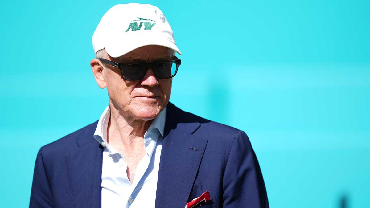 New York Jets owner Woody Johnson walks onto the field prior to the game between the Miami Dolphins and the New York Jets at Hard Rock Stadium.