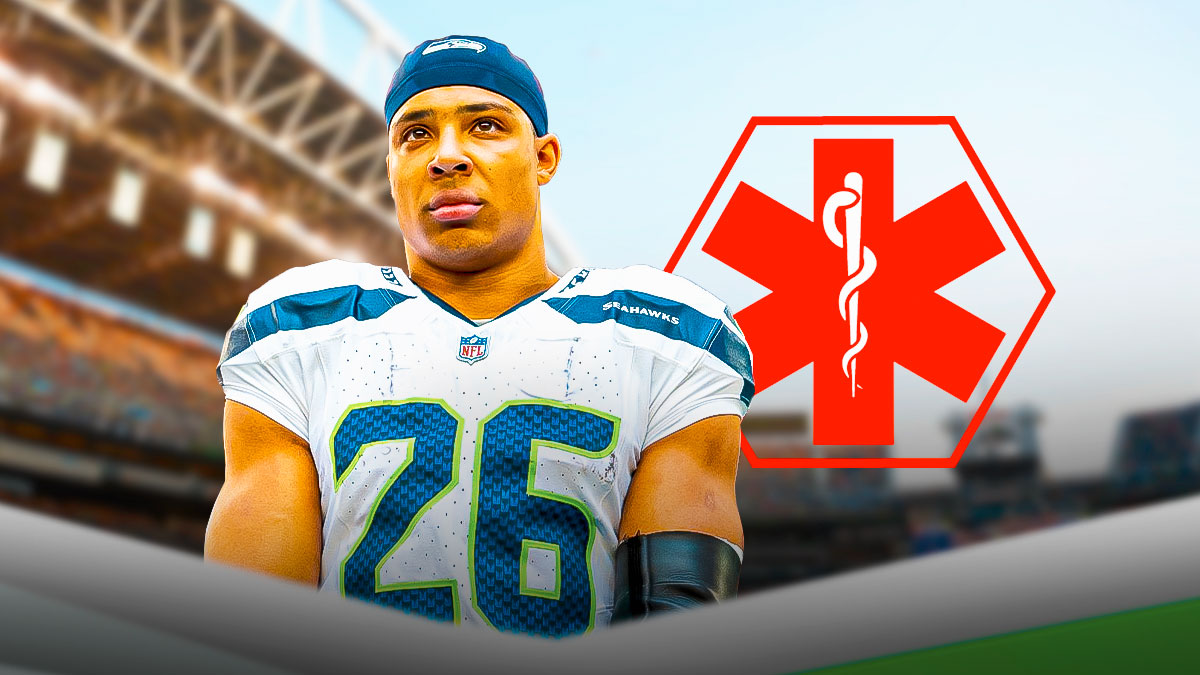 Zach Charbonnet in Seahawks gear with medical alert.