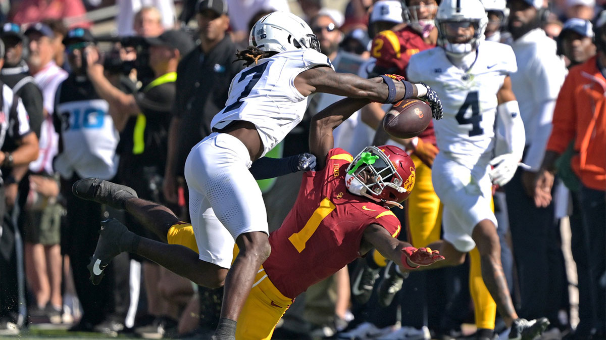 Oct 12, 2024; Los Angeles, California, USA; Penn State Nittany Lions cornerback Zion Tracy (7) breaks up a pass for USC Trojans wide receiver Zachariah Branch (1) in the second half at United Airlines Field at the Los Angeles Memorial Coliseum.