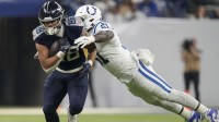 Indianapolis Colts defensive end Kwity Paye (51) dives to tackle Tennessee Titans tight end David Martin-Robinson (88) during a game against the Tennessee Titans at Lucas Oil Stadium at Lucas Oil Stadium.