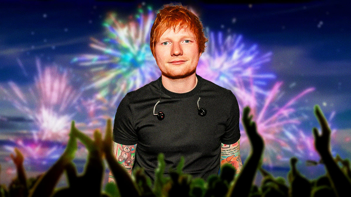 Ed Sheeran, who was rumored to be at JK Rowling's New Year's Eve party, with fireworks behind him.