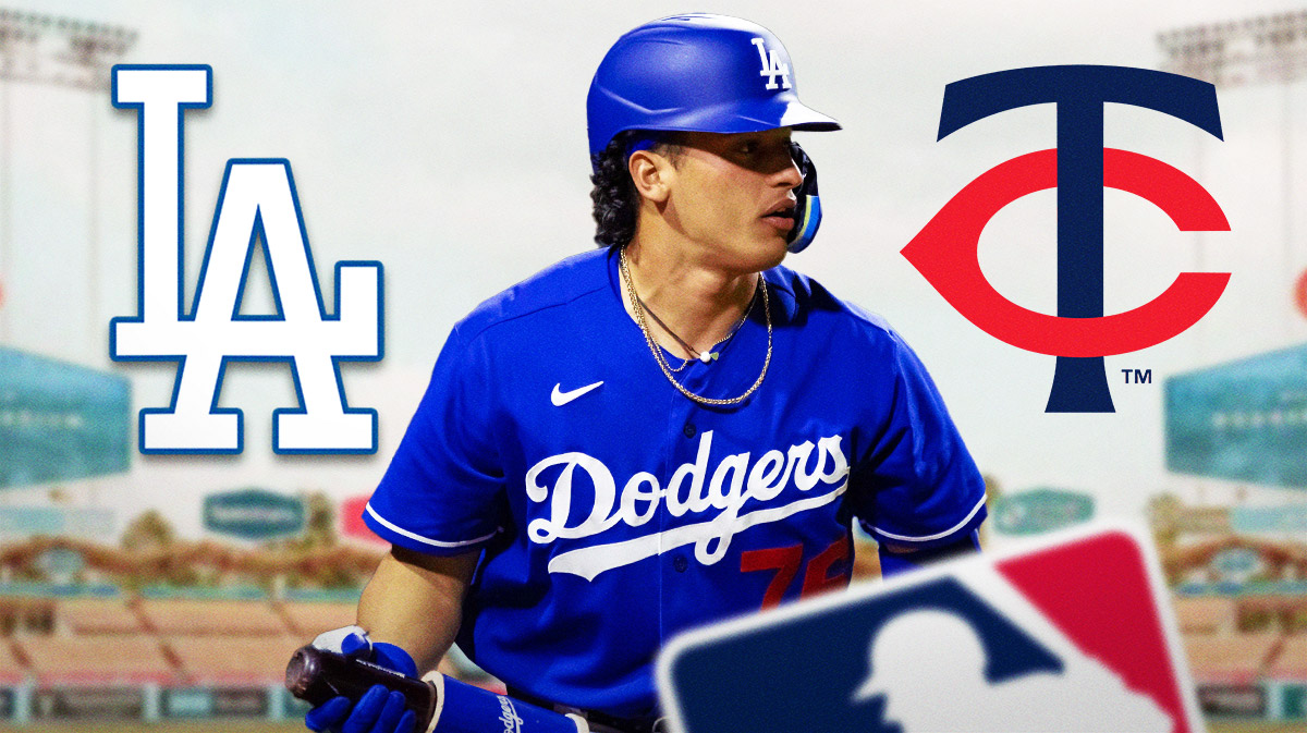 Diego Cartaya with Dodgers logo behind to right and Twins logo behind to left
