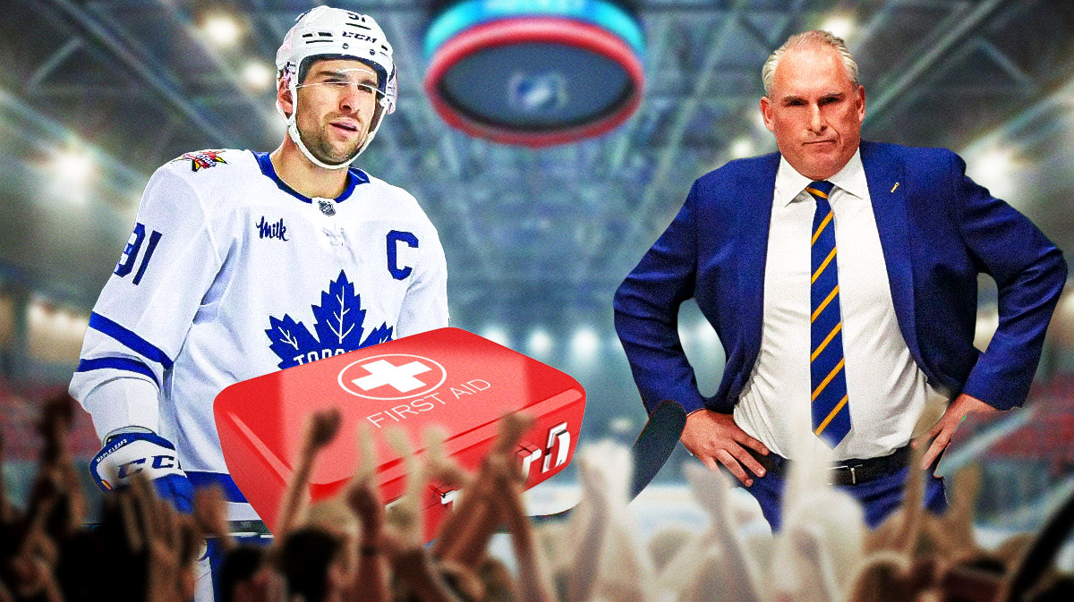 Maple Leafs forward John Tavares with a red medical bag, Leafs coach Craig Berube on the right