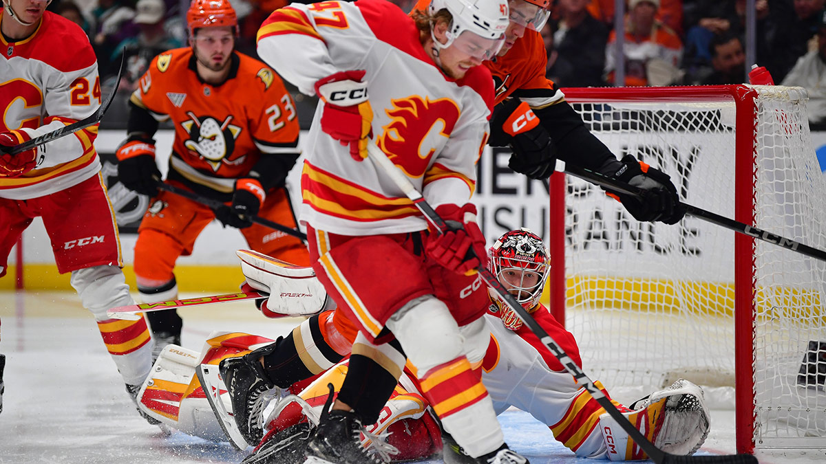 Calgary Flames center Connor Zary (47) gets the rebound against Anaheim Ducks left wing Cutter Gauthier (61) during the second period at Honda Center.