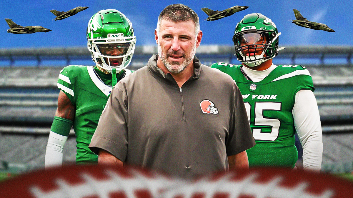 Mike Vrabel next to Sauce Gardner and Quinnen Williams with green and white fighter jets flying overhead.