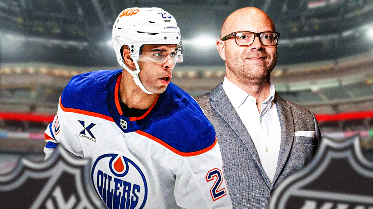 Oilers general manager Stan Bowman and defenseman Evan Bouchard inside Rogers Place in Edmonton