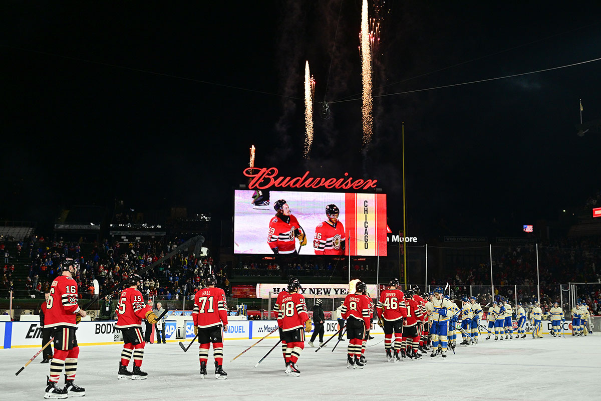 The Chicago Blackhawks and the St. Louis Blues shake hands after the Winter Classic at Wrigley Field. 