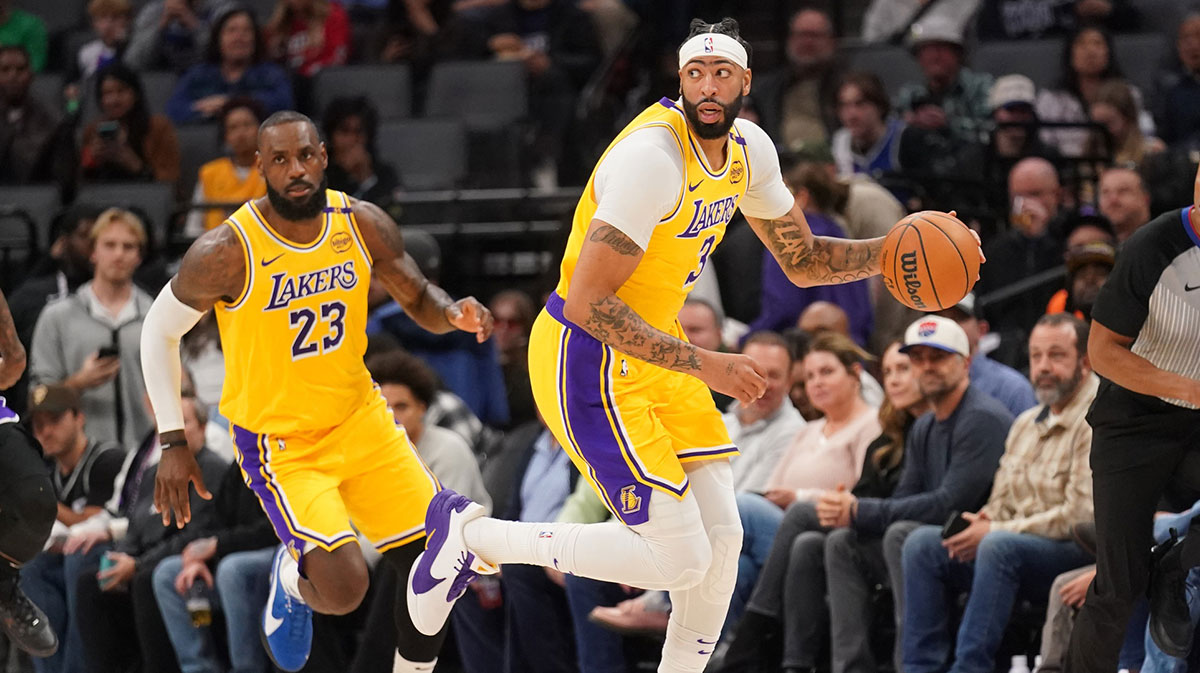 Los Angeles Lakers forward Anthony Davis (3) dribbles the ball next to forward LeBron James (23) against the Sacramento Kings in the first quarter at the Golden 1 Center.