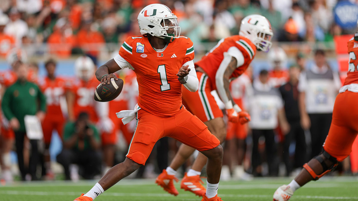 Miami Hurricanes quarterback Cam Ward (1) drops back to pass against the Iowa State Cyclones in the first quarter during the Pop Tarts bowl at Camping World Stadium
