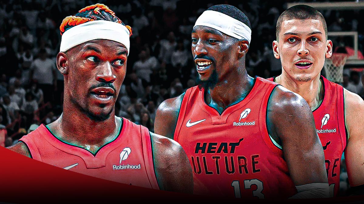 Miami Heat stars Tyler Herro and Bam Adebayo looking at Jimmy Butler in front of Kaseya Center.