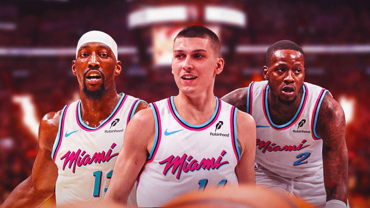 Miami Heat star Tyler Herro in the center with Bam Adebayo and Tery Rozier on either side in front of Kaseya Center.