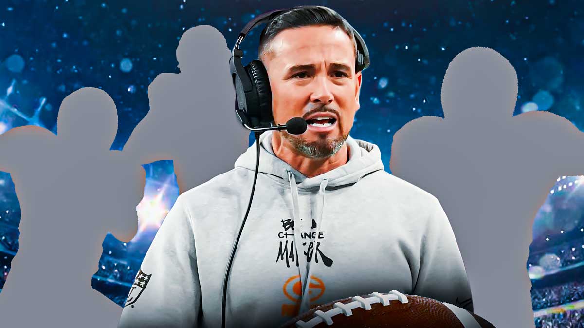 Matt LaFleur with three mystery players with the backdrop of Lambeau Field.