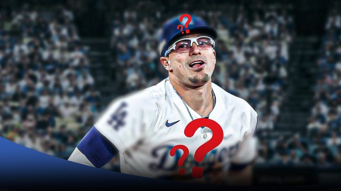 Kike Hernandez with Question Mark logo on hat and jersey