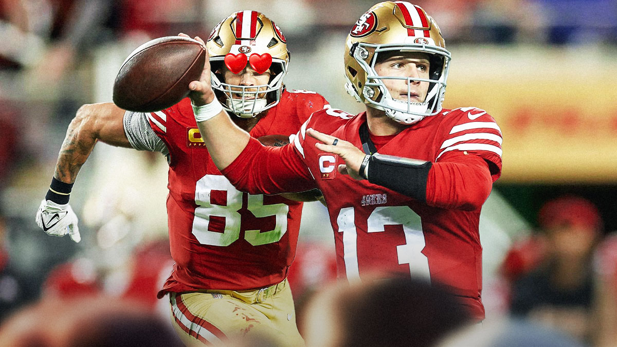 San Francisco 49ers TE George Kittle with heart eyes looking at QB Brock Purdy. Background is Levi's Stadium.