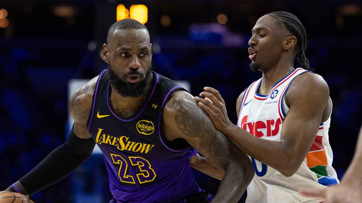 Philadelphia, Pennsylvania, USA; Los Angeles Lakers forward LeBron James (23) controls the ball against Philadelphia 76ers guard Tyrese Maxey (0) during the second quarter at Wells Fargo Center.