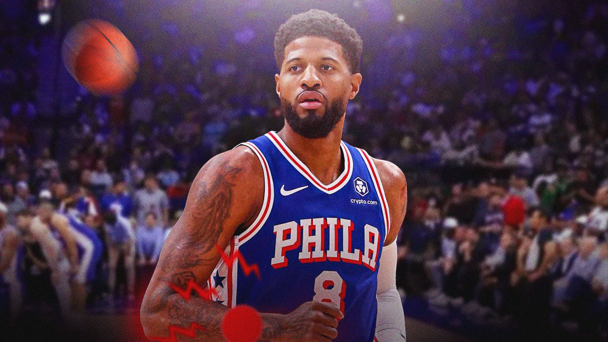 Paul George holds his left hand in pain