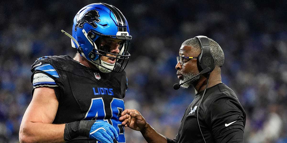 Detroit Lions defensive coordinator Aaron Glenn talks with linebacker Jack Campbell during the first half against the Minnesota Vikings at Ford Field in Detroit on Sunday, Jan. 5, 2025.