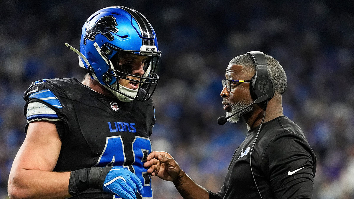 Detroit Lions defensive coordinator Aaron Glenn talks with linebacker Jack Campbell during the first half against the Minnesota Vikings at Ford Field in Detroit on Sunday, Jan. 5, 2025.