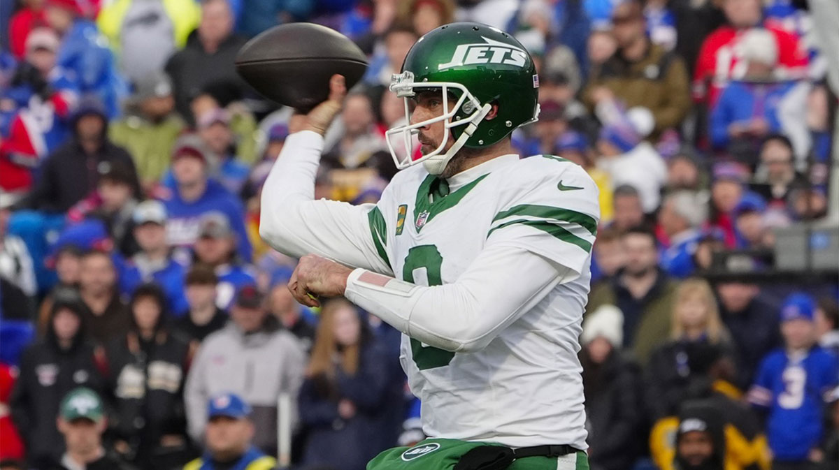 New York Jets quarterback Aaron Rodgers (8) throws the ball against the Buffalo Bills during the second half at Highmark Stadium.