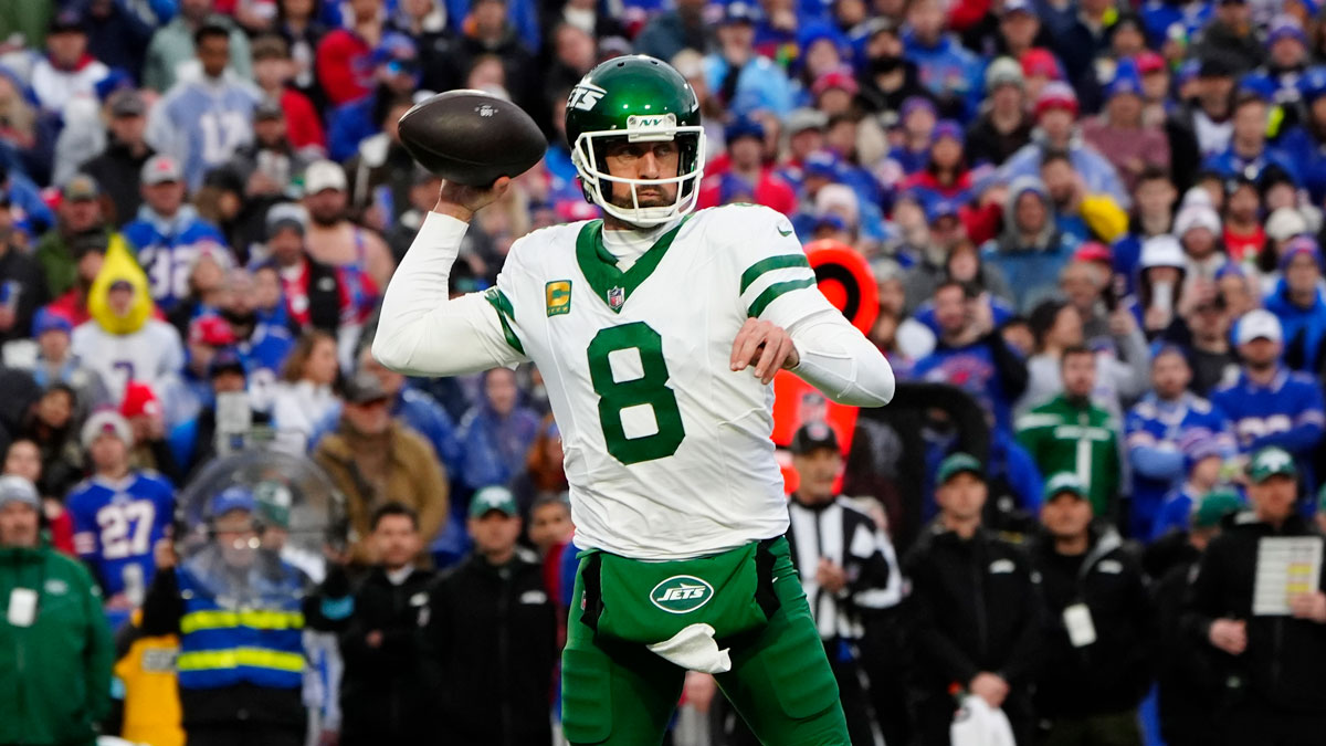 New York Jets quarterback Aaron Rodgers (8) throws the ball against the Buffalo Bills during the first half at Highmark Stadium. 