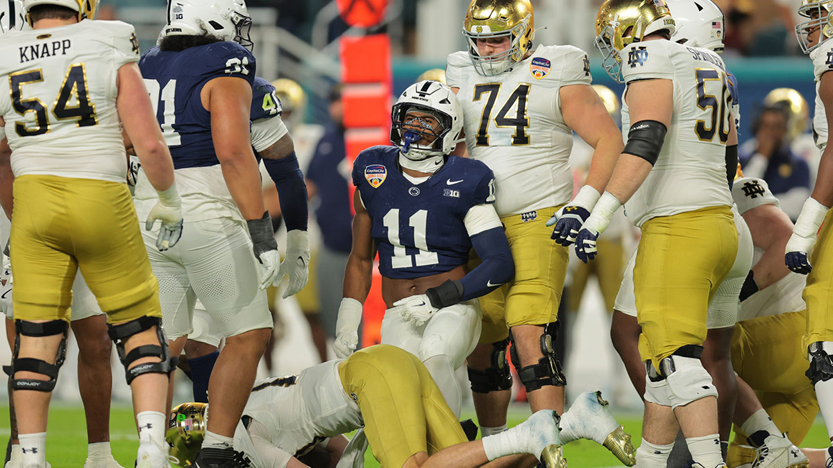 Penn State Nittany Lions defensive end Abdul Carter (11) celebrates a tackle on Notre Dame Fighting Irish quarterback Riley Leonard (13) in the first half in the Orange Bowl at Hard Rock Stadium.