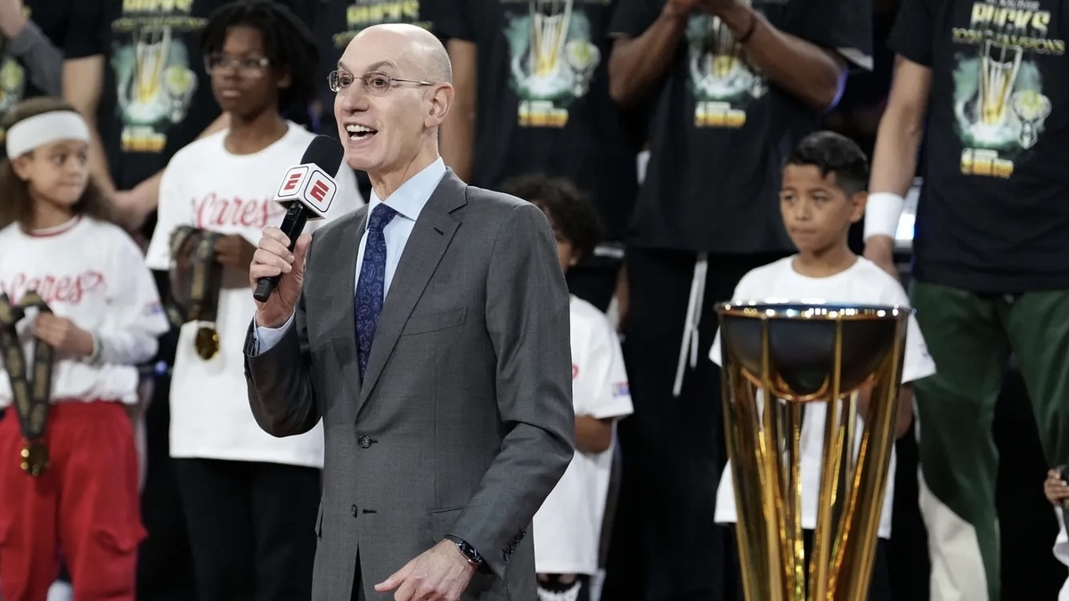 NBA commissioner Adam Silver presents the trophy to the Milwaukee Bucks after they won the Emirates NBA Cup championship game against the Oklahoma City Thunder at T-Mobile Arena.