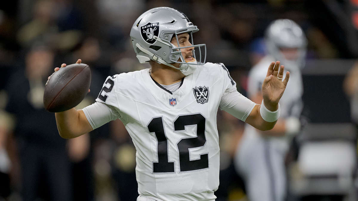 Dec 29, 2024; New Orleans, Louisiana, USA; Las Vegas Raiders quarterback Aidan O'Connell (12) throws against the New Orleans Saints during the first half at Caesars Superdome. Mandatory Credit: Matthew Hinton-Imagn Images