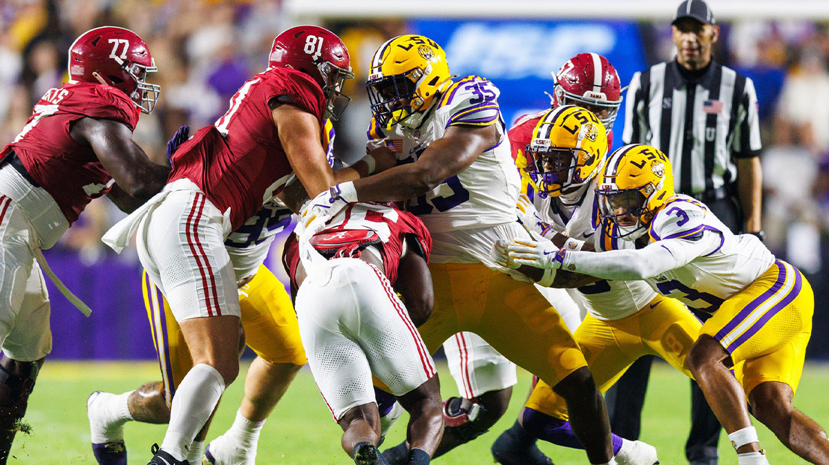 Nov 9, 2024; Baton Rouge, Louisiana, USA; Alabama Crimson Tide linebacker Jeremiah Alexander (35) makes a tackle against Alabama Crimson Tide running back Jam Miller (26) at Tiger Stadium. Mandatory Credit: Stephen Lew-Imagn Images