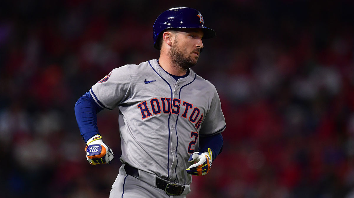 Houston Astros third baseman Alex Bregman (2) hits a single against the Los Angeles Angels during the seventh inning at Angel Stadium.