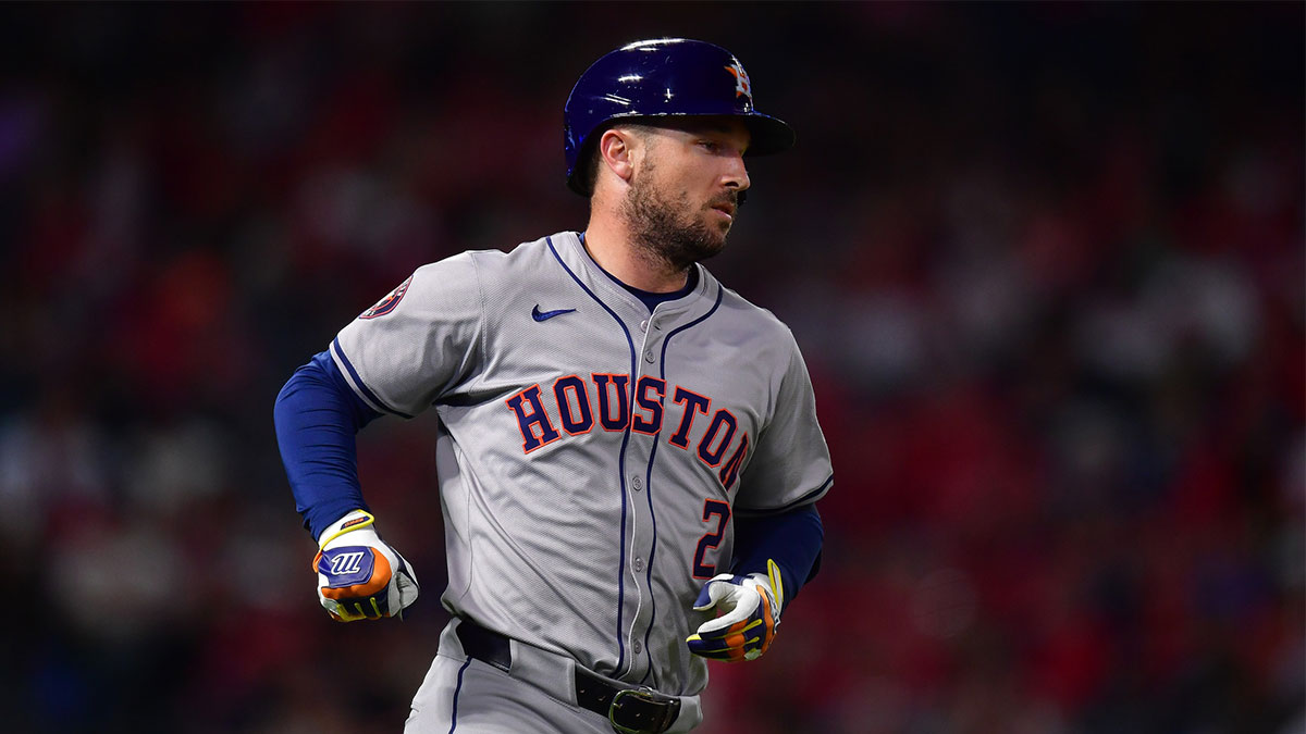 Houston Astros third baseman Alex Bregman (2) hits a single against the Los Angeles Angels during the seventh inning at Angel Stadium.