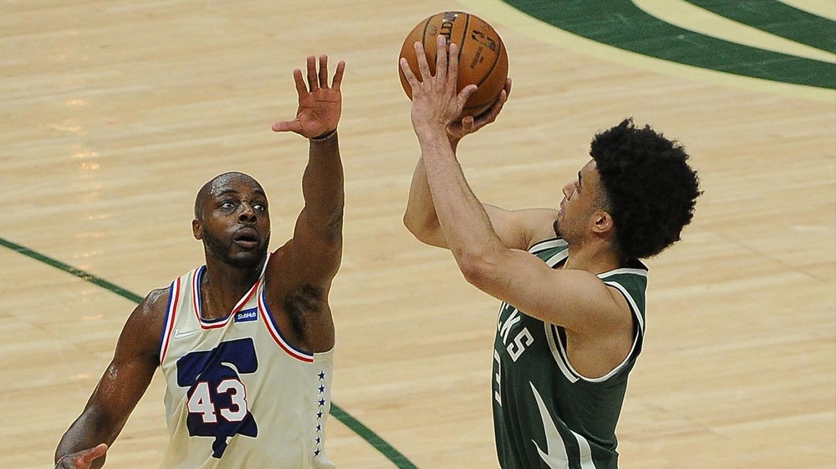 Milwaukee Bucks forward Jordan Nwora (13) puts up a shot against Philadelphia 76ers forward Anthony Tolliver (43) in the fourth quarter at Fiserv Forum. Final Milwaukee Bucks 132 Philadelphia 76ers 94.