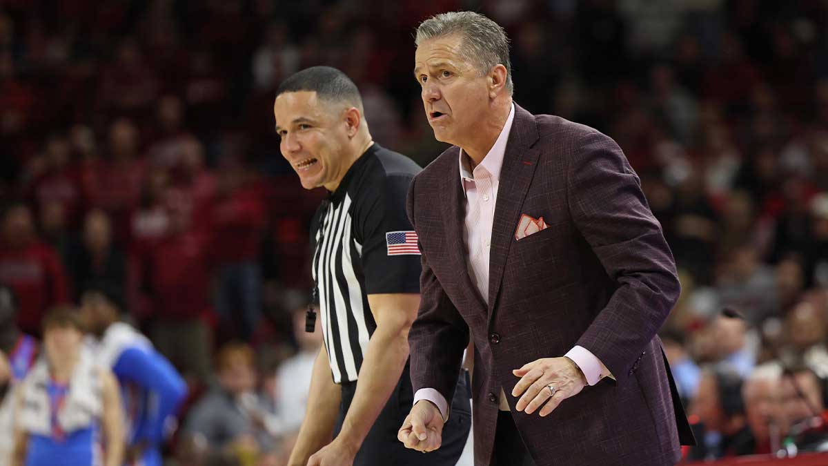 Arkansas Razorbacks head coach John Calipari discusses a call with an official during the second half against the Ole Miss Rebels at Bud Walton Arena. Ole Miss won 73-66. 