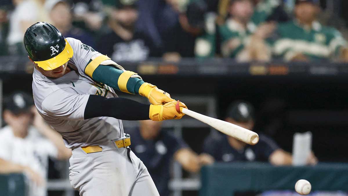 Oakland Athletics outfielder Brent Rooker (25) hits a two-run single against the Chicago White Sox during the sixth inning at Guaranteed Rate Field.