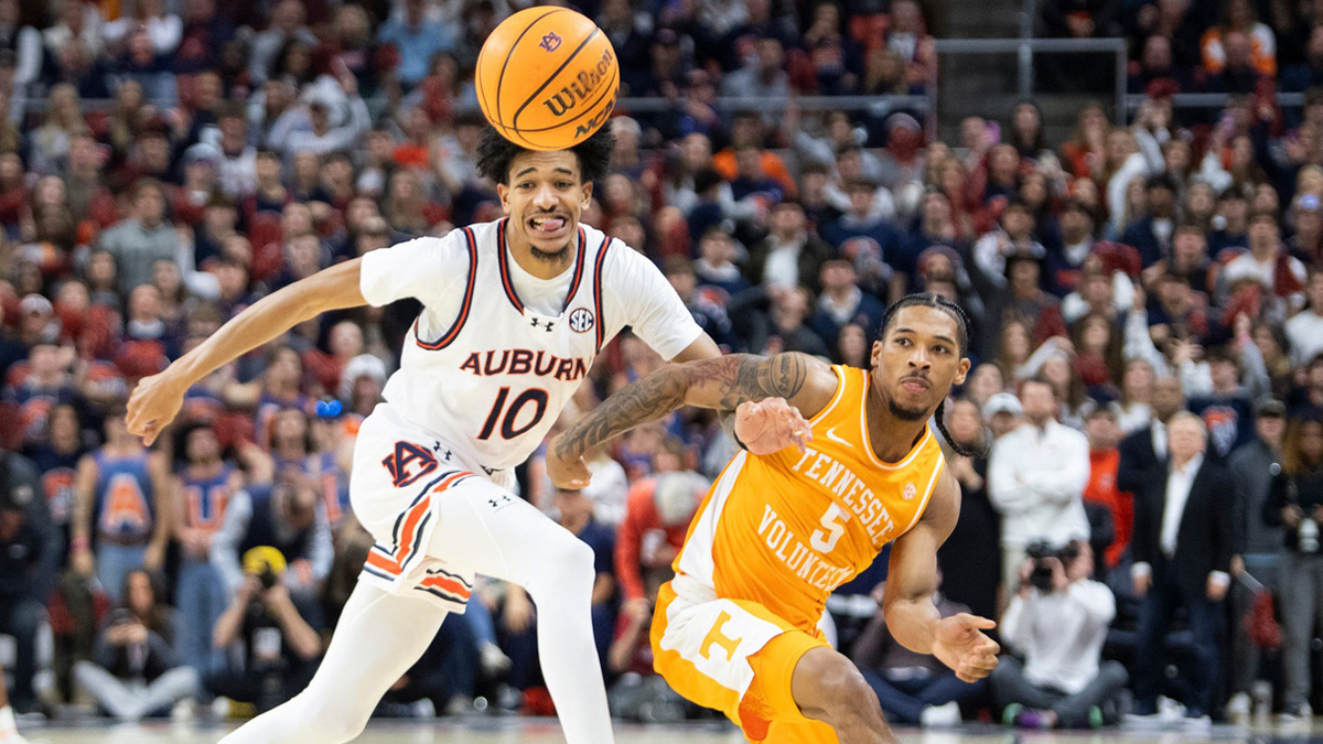 Auburn Tigers guard Chad Baker-Mazara (10) and Tennessee Volunteers guard Zakai Zeigler (5) fight for a loose ball as Auburn Tigers take on Tennessee Volunteers at Neville Arena in Auburn, Ala., on Saturday, Jan. 25, 2025.