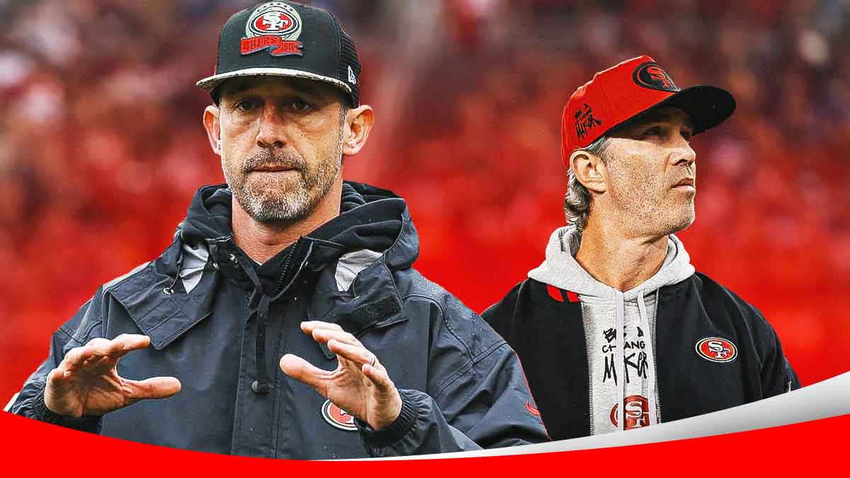 Kyle Shanahan next to Nick Sorensen in front of the 49ers stadium