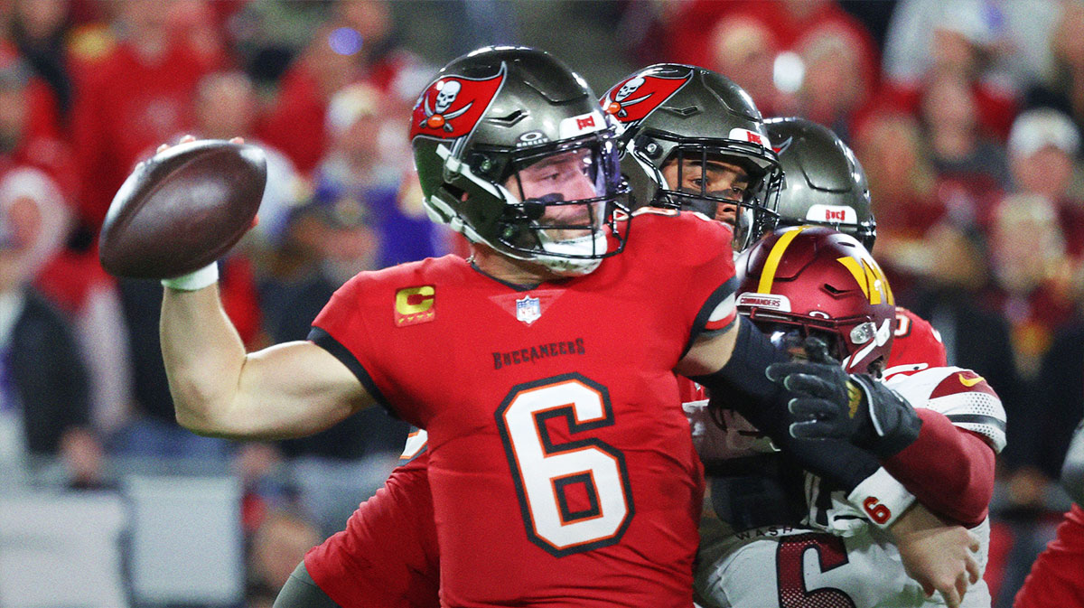 Jan 12, 2025; Tampa, Florida, USA; Tampa Bay Buccaneers quarterback Baker Mayfield (6) throws against Washington Commanders linebacker Dante Fowler Jr. (6) during the second quarter of a NFC wild card playoff at Raymond James Stadium.